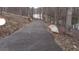 Scenic paved path winds through the trees with beautiful lake views at 8155 Stone Hill Rd, Cumming, GA 30028