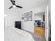 Bright bedroom featuring a ceiling fan, carpet flooring, and a view to a workspace at 821 Ralph Mcgill Ne Blvd # 3201, Atlanta, GA 30306