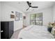 Bright bedroom with a ceiling fan, carpet flooring, a big window and art decoration on the walls at 821 Ralph Mcgill Ne Blvd # 3201, Atlanta, GA 30306