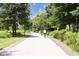 People enjoying a bike ride on the paved path through the green, treed area at 821 Ralph Mcgill Ne Blvd # 3201, Atlanta, GA 30306