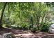 A common area with landscaping, a brick path, and shade trees at 821 Ralph Mcgill Ne Blvd # 3201, Atlanta, GA 30306