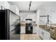 Well-equipped kitchen featuring modern appliances, tile flooring, and bright cabinetry at 821 Ralph Mcgill Ne Blvd # 3201, Atlanta, GA 30306