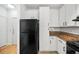 Kitchen with modern appliances and granite countertops adjacent to a white door at 821 Ralph Mcgill Ne Blvd # 3201, Atlanta, GA 30306
