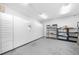 This mail room features a wall of white mailboxes and package shelves at 821 Ralph Mcgill Ne Blvd # 3201, Atlanta, GA 30306