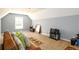 This bonus room offers ample space for relaxation and features vaulted ceilings and neutral carpeting at 892 Creek Bottom Rd, Loganville, GA 30052