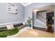Stylish entryway with bench seating, tile flooring, and staircase to the upper level at 892 Creek Bottom Rd, Loganville, GA 30052