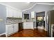 Bright kitchen featuring stainless steel appliances, granite countertops, and mosaic tile backsplash at 892 Creek Bottom Rd, Loganville, GA 30052