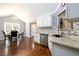 Kitchen and breakfast nook with stainless steel appliances, granite countertops, and dark hardwood floors at 892 Creek Bottom Rd, Loganville, GA 30052