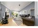 Comfortable living room with a fireplace, tile flooring, and neutral wall colors at 892 Creek Bottom Rd, Loganville, GA 30052