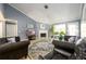 Spacious living room with high ceilings, a fireplace, and stylish furnishings at 892 Creek Bottom Rd, Loganville, GA 30052