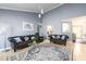 Bright and airy living room with comfortable seating and a modern decorative rug at 892 Creek Bottom Rd, Loganville, GA 30052