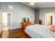 Spacious main bedroom with vaulted ceiling, hardwood floors, and ample closet space at 892 Creek Bottom Rd, Loganville, GA 30052