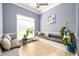 Cozy sitting area with bench seating, tile floors, and natural light from large windows at 892 Creek Bottom Rd, Loganville, GA 30052