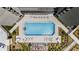 Aerial view of community pool with seating areas and modern landscaping at 2660 Peachtree Nw Rd # 14D, Atlanta, GA 30305
