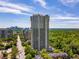 Stunning high-rise building near lush greenery and city skyline views, offering luxury living at 2660 Peachtree Nw Rd # 14D, Atlanta, GA 30305
