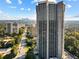 Stunning aerial view of the high-rise property with city skyline and tree-lined streets in the background at 2660 Peachtree Nw Rd # 14D, Atlanta, GA 30305