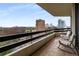 Enjoy the city skyline from the private balcony, furnished with comfortable seating and tile flooring at 2660 Peachtree Nw Rd # 14D, Atlanta, GA 30305