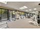 Well-equipped gym offering a variety of machines and weights, with large windows for natural light at 2660 Peachtree Nw Rd # 14D, Atlanta, GA 30305