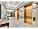 Elegant hallway with elevators, modern lighting, and stylish decor at 2660 Peachtree Nw Rd # 14D, Atlanta, GA 30305