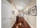 Inviting hallway featuring hardwood floors, recessed lighting, and decorative artwork at 2660 Peachtree Nw Rd # 14D, Atlanta, GA 30305