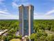 Stunning high-rise with breathtaking views surrounded by lush greenery on a beautiful sunny day at 2660 Peachtree Nw Rd # 14D, Atlanta, GA 30305