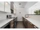 Kitchenette with stainless steel appliances and sleek cabinetry at 2660 Peachtree Nw Rd # 14D, Atlanta, GA 30305