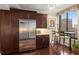 A kitchen featuring wood cabinets, granite countertops, stainless steel appliances, and city views at 2660 Peachtree Nw Rd # 14D, Atlanta, GA 30305