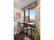 A cozy breakfast nook offers city views with a granite table, seating, and floral decor at 2660 Peachtree Nw Rd # 14D, Atlanta, GA 30305