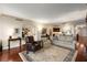 Spacious open concept living room with hardwood floors and an inviting atmosphere and neutral paint at 2660 Peachtree Nw Rd # 14D, Atlanta, GA 30305