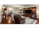 Open floor plan with hardwood floors, a built-in entertainment center, and comfortable seating at 2660 Peachtree Nw Rd # 14D, Atlanta, GA 30305