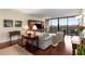 Cozy living room with floor to ceiling glass and a balcony, perfect for relaxing and enjoying the view at 2660 Peachtree Nw Rd # 14D, Atlanta, GA 30305