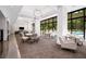 Lounge area with tables, chairs, and a view of the pool at 2660 Peachtree Nw Rd # 14D, Atlanta, GA 30305