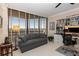 The office has a built-in desk, shelving, comfortable seating, and large window views at 2660 Peachtree Nw Rd # 14D, Atlanta, GA 30305