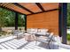 An outdoor patio with comfortable seating, modern pergola, privacy wall and shade at 2660 Peachtree Nw Rd # 14D, Atlanta, GA 30305
