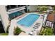 A luxurious community pool with plenty of lounge chairs is set against lush landscaping at 2660 Peachtree Nw Rd # 14D, Atlanta, GA 30305