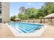 Refreshing pool with lounge chairs and well-maintained landscaping, perfect for relaxation at 2660 Peachtree Nw Rd # 14D, Atlanta, GA 30305
