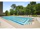 Beautiful pool and lounge area surrounded by lush landscaping and comfortable seating at 2660 Peachtree Nw Rd # 14D, Atlanta, GA 30305