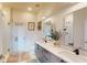 Bright bathroom featuring a double sink vanity, modern fixtures, and a glass-enclosed shower at 112 Rogers St # 409, Atlanta, GA 30317