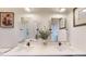 Modern bathroom with a double sink vanity, sleek faucets, and decorative mirrors at 112 Rogers St # 409, Atlanta, GA 30317