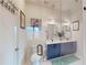 Well-lit bathroom features a toilet, a shower with glass door, and dual sink vanity at 112 Rogers St # 409, Atlanta, GA 30317