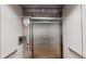 Modern stainless steel elevator with user panel and floor indicator at 112 Rogers St # 409, Atlanta, GA 30317