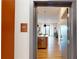 Entryway to unit 409 with kitchen view, stainless steel appliances, and hardwood floors at 112 Rogers St # 409, Atlanta, GA 30317