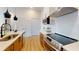 Modern kitchen with stainless steel appliances, white countertops, and sleek wooden cabinetry at 112 Rogers St # 409, Atlanta, GA 30317