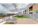 Rooftop deck with lounge chairs, tables, and an outdoor fireplace with built in seating at 112 Rogers St # 409, Atlanta, GA 30317