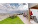 The rooftop deck area features lounge seating, and tables for outdoor enjoyment at 112 Rogers St # 409, Atlanta, GA 30317