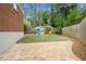 Backyard features a brick patio and a play structure for outdoor fun at 1265 Oldfield Rd, Decatur, GA 30030