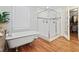 Bright bathroom featuring a soaking tub, glass-enclosed shower, hardwood flooring, and a walk-in closet at 1265 Oldfield Rd, Decatur, GA 30030