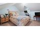 Cozy bedroom showcasing a comfortable bed, bedside table, wall-mounted TV, and neutral decor at 1265 Oldfield Rd, Decatur, GA 30030