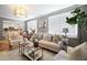 Bright living room with neutral tones, stylish furnishings, and large windows offering plenty of natural light at 1265 Oldfield Rd, Decatur, GA 30030