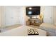 Cozy living room featuring a neutral sofa, large television, and playful decor at 1265 Oldfield Rd, Decatur, GA 30030